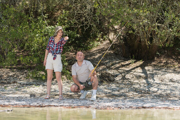 a couple by a lake