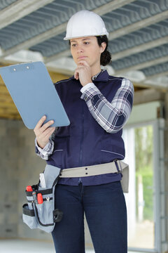 young technician carrying out inspection at construction site
