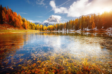Great rocks over the lake Antorno in National Park Tre Cime di Lavaredo. Location Dolomite alps, Italy, Europe.