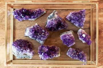 amethyst crystal stones in a glas box for luxury decoration