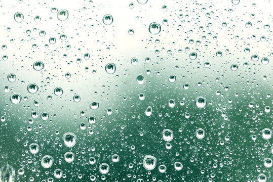 waterdrops on green surface, abstract background, space for text