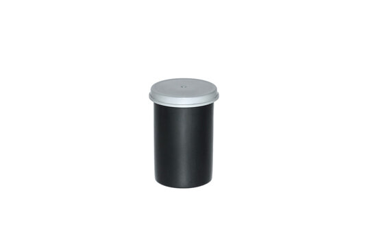Black plastic film case with grey cap. Body for the photo film. Isolated on white background