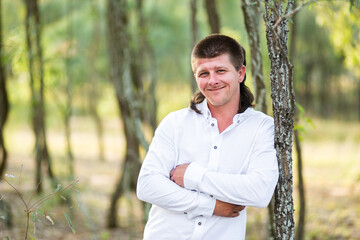 Portrait of a smiling man in gum tree forest