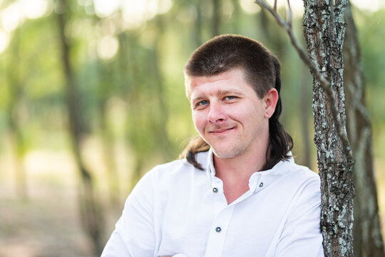 Portrait of a smiling man in gum tree forest