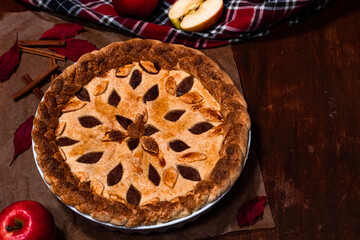 American apple pie flat lay with fall decoration on a table looking delicious