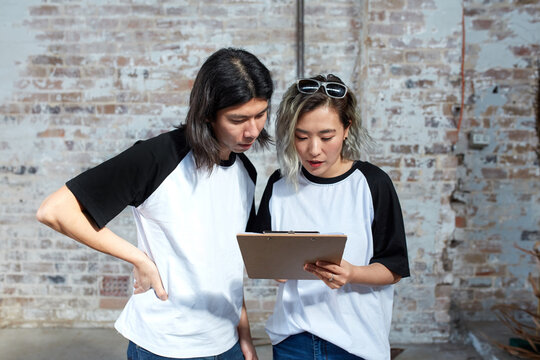 Young event planners working together on set