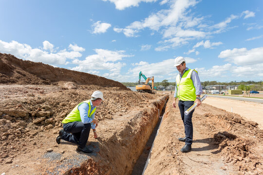 Two property developers surveying a tunnel on-site