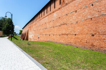 Fototapeta na wymiar Red brick wall of medieval Kolomna Kremlin, Russia
