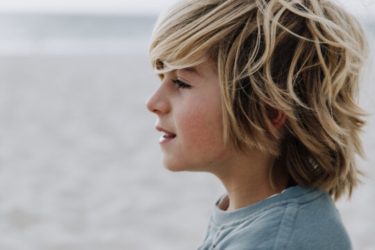Young boy looking at ocean