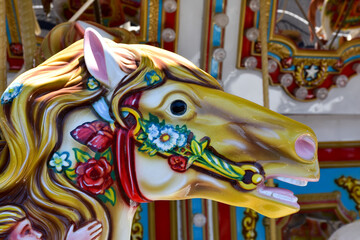 Fototapeta na wymiar carousel horses on a merry-go-round