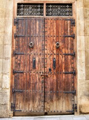 Old and colorful wooden door with iron details