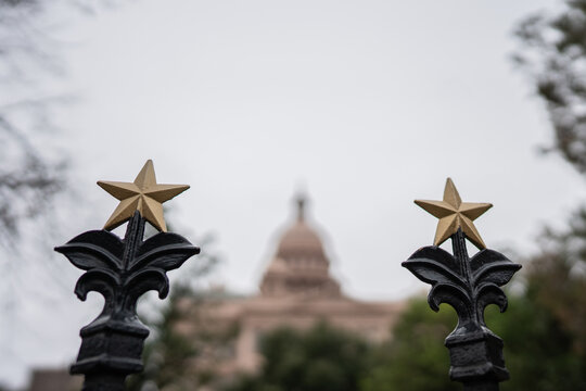 Austin Capitol Building through the gate's stars