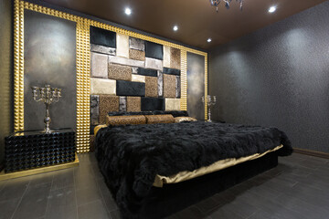 luxurious romantic room in a pompous style in black and gold colors with magnificent furniture