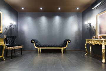 luxurious romantic room in a pompous style in black and gold colors with magnificent furniture