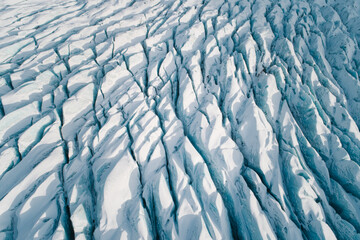 Abstract aerial view of the Crevasses of Svínafellsjökull outlet glacier in winter, Vatnajökull...
