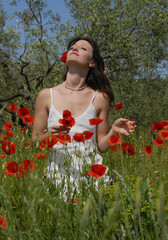 young woman in poppies
