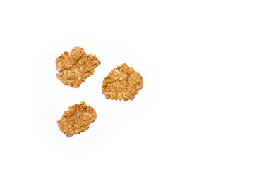 Three cloxe-up macro dietic fitness cornflakes isolated on the white background