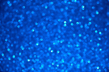 blue glitter texture christmas abstract background with bokeh