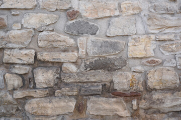 old horizontal large stones wall with gray cement for textures, backgrounds and matte painting