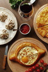 dishes and snacks of traditional Caucasian Georgian cuisine. classic national serving on a rustic wooden table