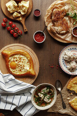dishes and snacks of traditional Caucasian Georgian cuisine. classic national serving on a rustic wooden table