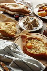 dishes and snacks of traditional Caucasian Georgian cuisine. classic national serving on a rustic wooden table