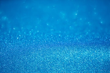 blue glitter texture christmas abstract background with bokeh