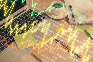 Multi exposure of forex graph drawing and desktop with coffee and items on table background. Concept of financial market trading