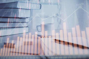 Double exposure of financial chart drawing and desktop with coffee and items on table background. Concept of forex market trading