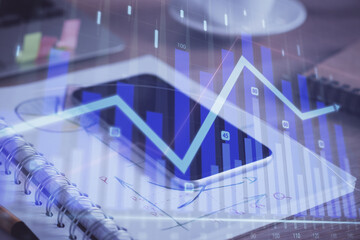 Double exposure of forex chart drawing and cell phone background. Concept of financial data analysis