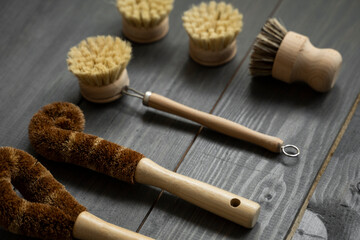 Set of brushes for eco-cleaning the home, washing dishes and surfaces without chemicals and plastic. Zero waste kitchen cleaning concept. Eco friendly natural cleaning bamboo dish brushes.