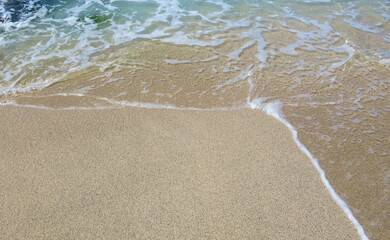 Ocean wave on the sand 
