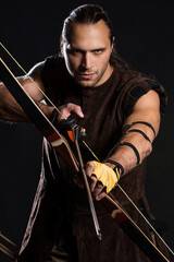Young man with bow and historical costume