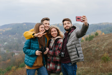 group of happy young travelers enjoying natureм