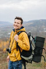 young traveler man with retro photo camera