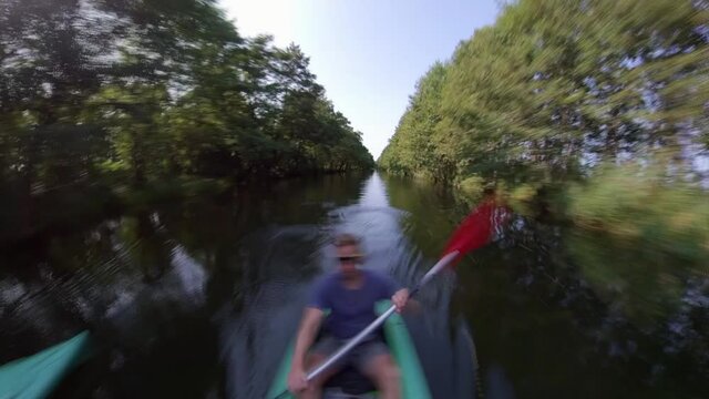 Father and Daughter Kayaking Down the River Hyper Lapse