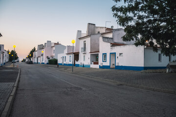 Fototapeta na wymiar evening street with beautiful white houses. houses in portugal