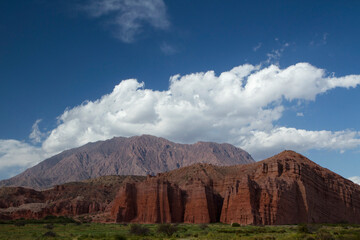 Geology. Panorama view of the valley, grassland, mountains, red rock and sandstone hill called The Castles in Cafayate, Salta, Argentina.