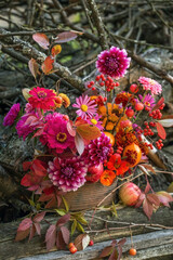 Autumn fall flowers bouquet, florist pink orange red composition with dahlia and apples