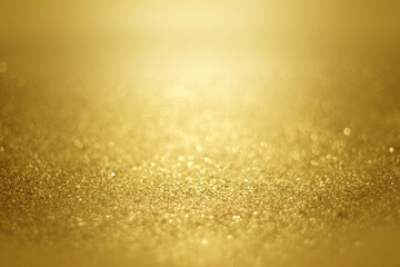 gold glitter abstract background with blurred shiny backdrop texture for Christmas and Valentine. 