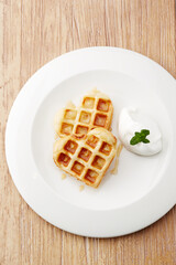 heart shaped waffles on a white plate, top view