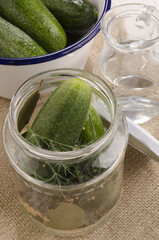 pickled gherkin with spice in a glass