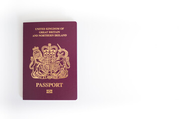 New UK British United Kingdom Passport flatlay against white blank background with copy space
