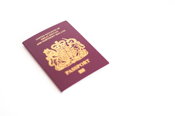 New UK British United Kingdom Passport flatlay against white blank background with copy space