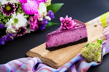 Obraz na płótnie Canvas Homemade cheesecake with fresh blueberries and mint for dessert - healthy organic summer dessert pie cheesecake. Creative atmospheric decoration