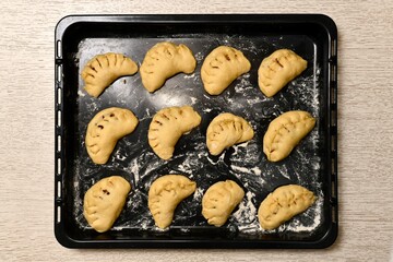 Sweet pies from yeast dough, raw semi-finished.