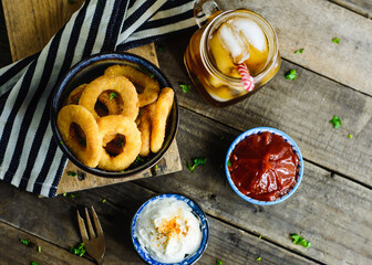 Onion rings, sauces and soda