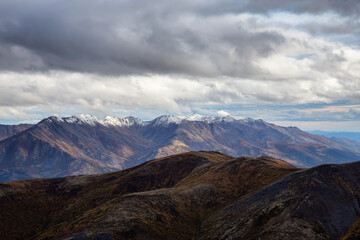 Beautiful View of Scenic Landscape and Mountains in Canadian Nature. Season change from Fall to Winter. Taken in Tombstone Territorial Park, Yukon, Canada.