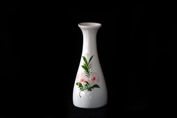 Traditional Japanese Sake liquor vase on black background