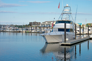 Motorboats lining the docks in a marina in Belmar, New Jersey, on a beautiful sunny day.
 -03